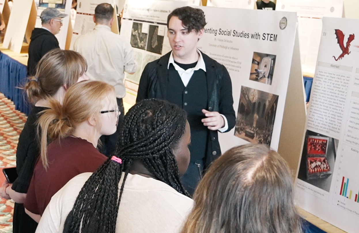 Students looking at informational posters at SPACE