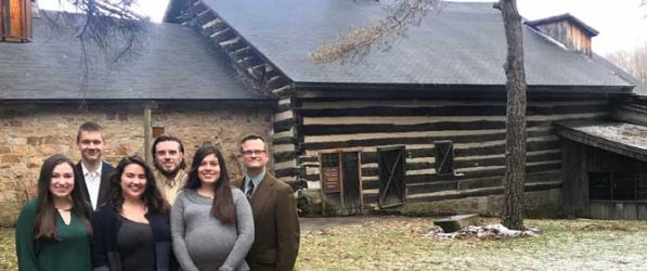 Image from left Public History students Erin White, Jonathan Van Dermark, Kelsey Chabal, Cameron Carr, Yamila Audisio, and Professor Paul Douglas Newman in front of the Jennerstown Mountain Playhouse 