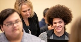 student in class with professor 