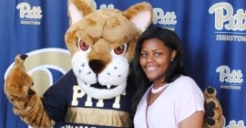 student and Pitt Johnstown mascot 