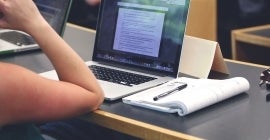 laptop and book on desk