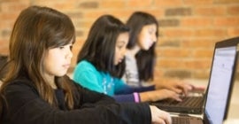 young girl using a computer