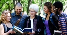 poeple looking at a book