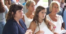 Women with papers listening 