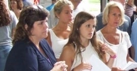 Women with papers listening 