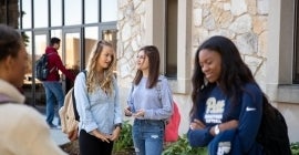 students talking outside