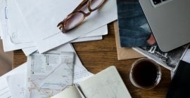 glasses and papers on a desk