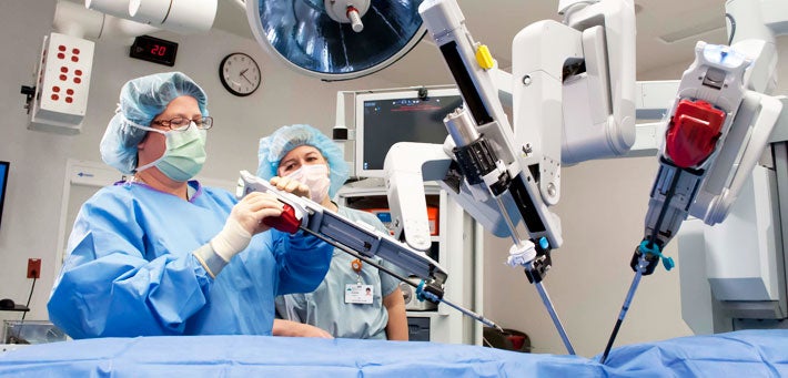 woman using surgical equipment