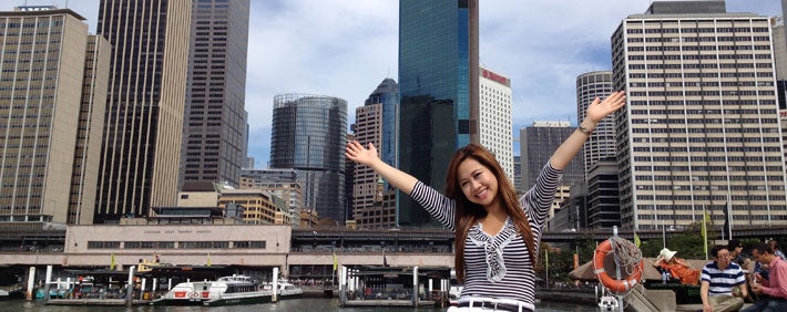 student standing in a big city